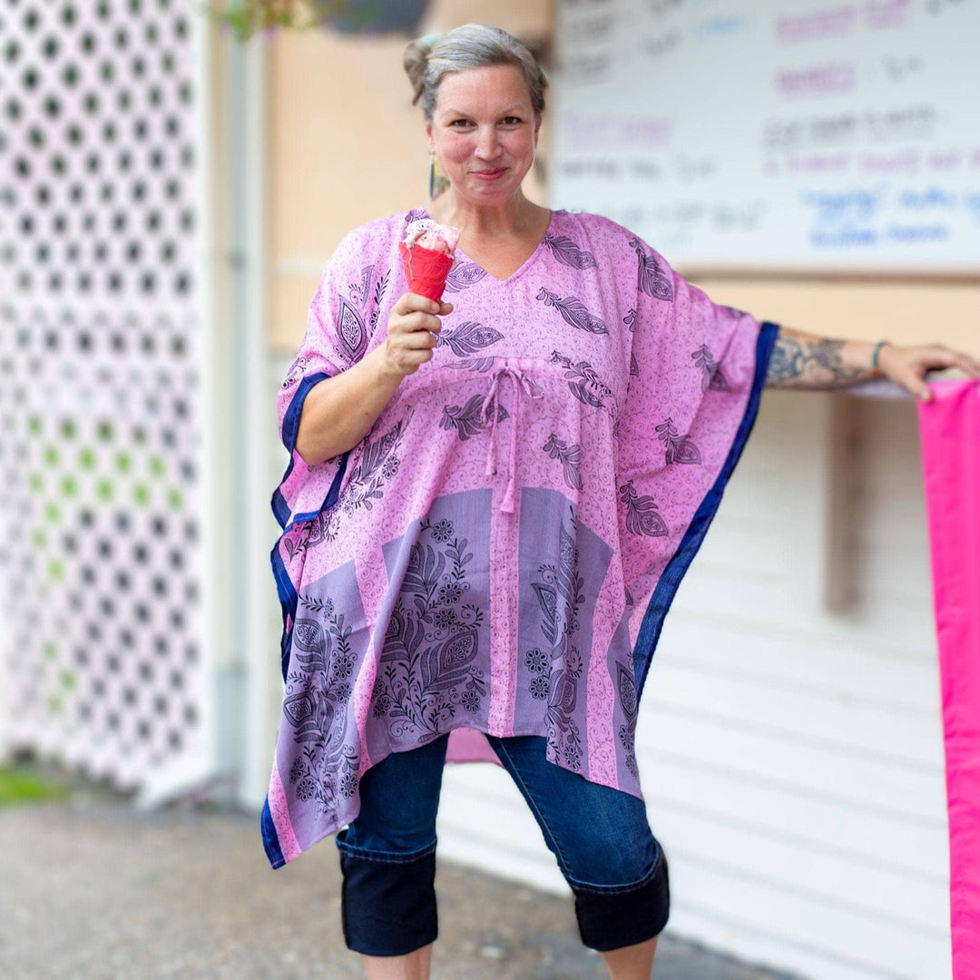 woman wearing pink short kaftan with capri jeans