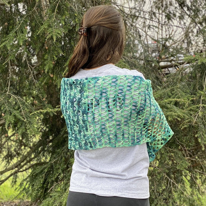 women wearing a green shawl outside