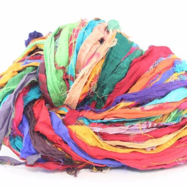 At The Bahamas (multicolored) sari silk ribbon yarn ball on a white background