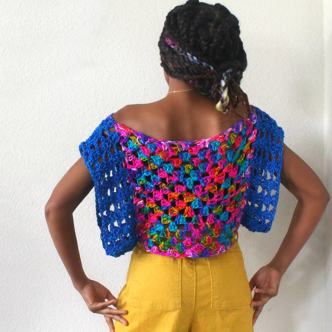 Back view of designer wearing easy crochet top in front of a white background.