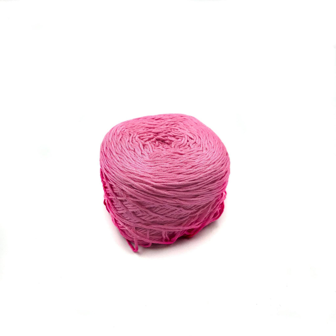 Viscose & Cotton Baby Yarn cake in Orchid (pink) on a white background