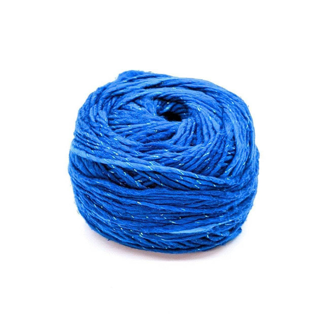 A cake of sparkle blue yarn on a white background