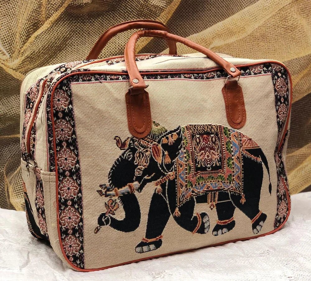 Canvas bag with intricate black elephant embroidery and ornate patterns.