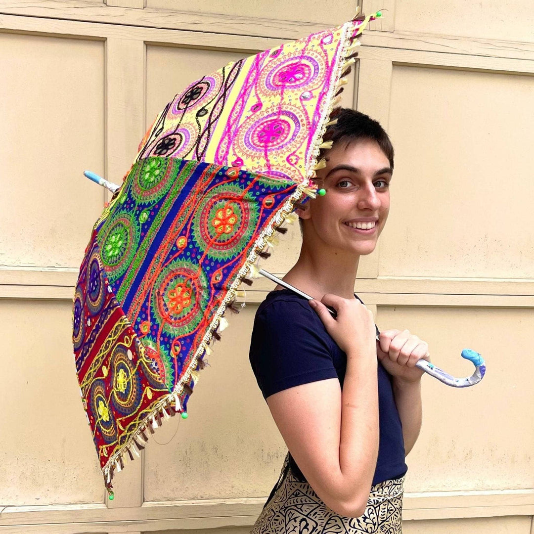 A woman holding a hand embellished parasol