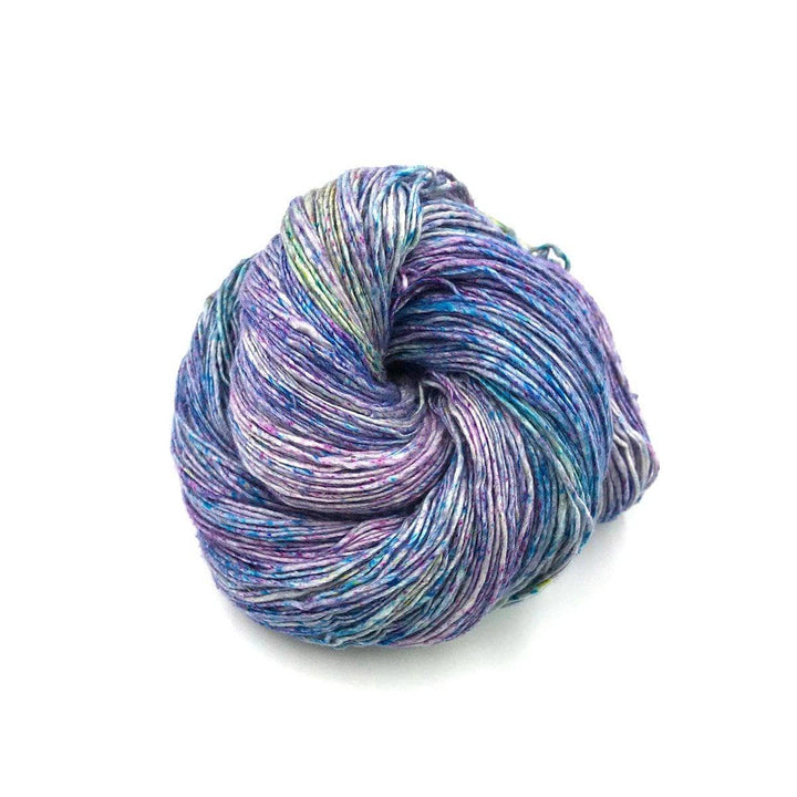 multicolored cake of yarn in a white background