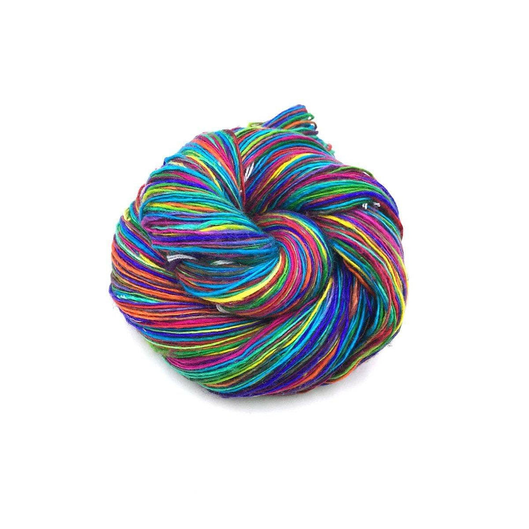 multicolored cake of yarn in a white background