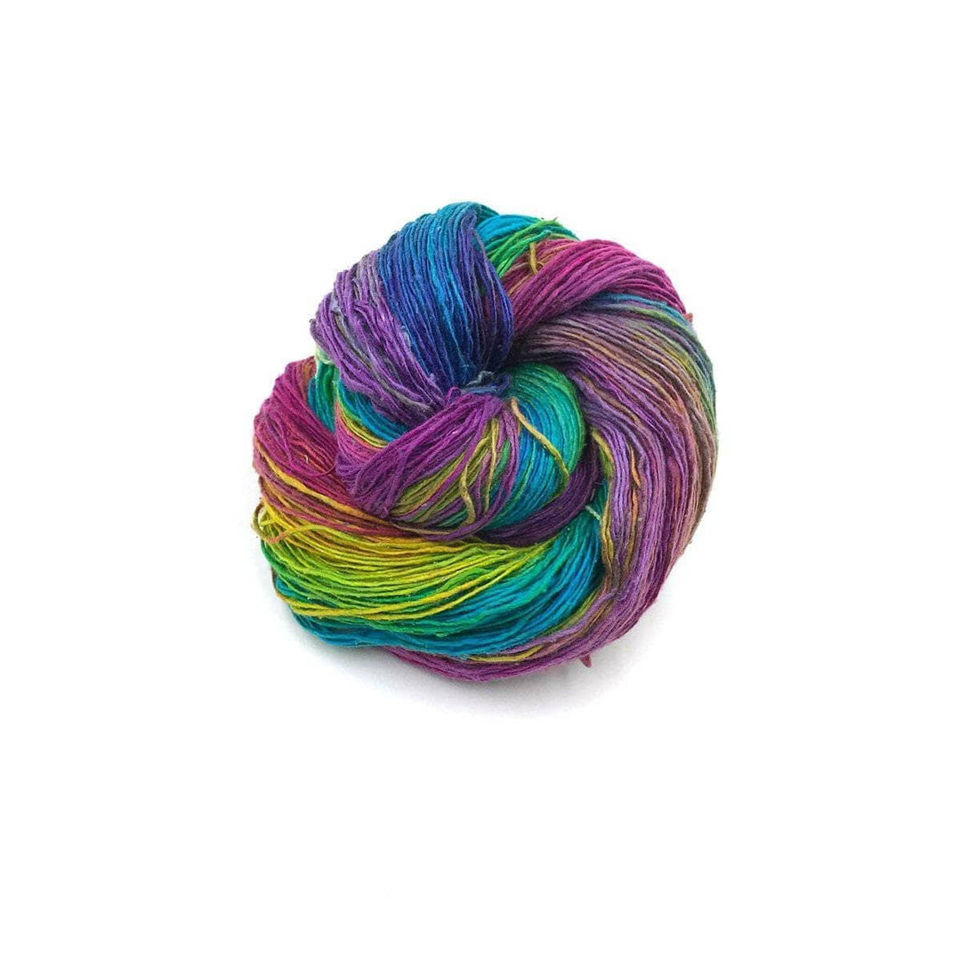 multicolored cake of yarn in a white background