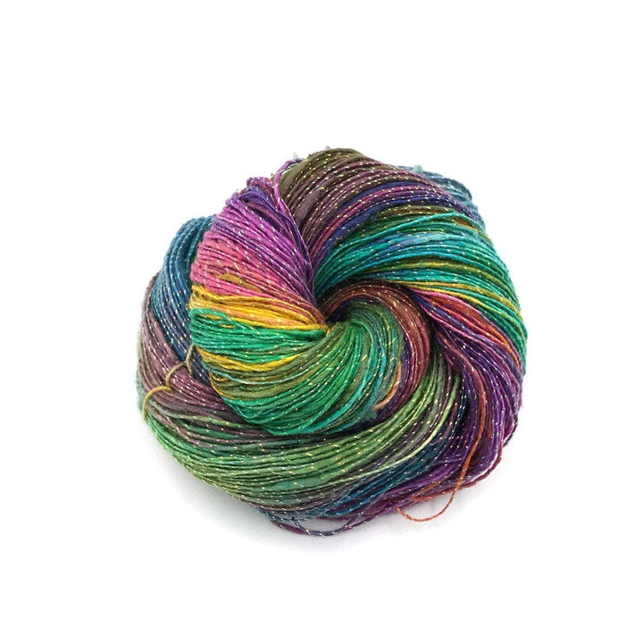  cake of yarn in a white background