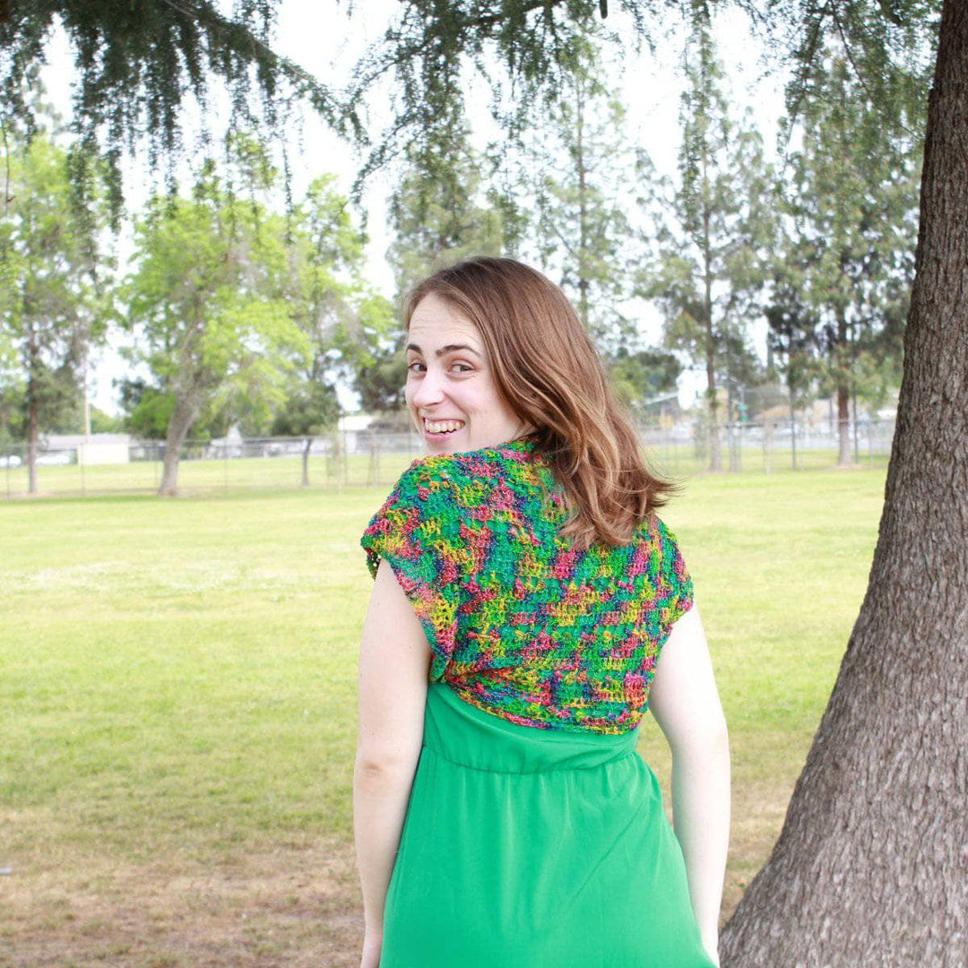 woman wearing the multicolored Emerald Pools Bolero Jacket outdoors