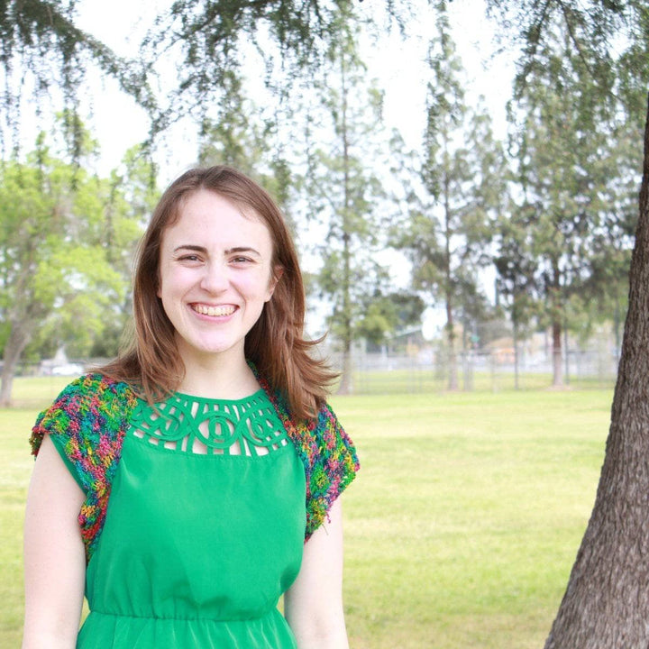 woman wearing the multicolored Emerald Pools Bolero Jacket outdoors