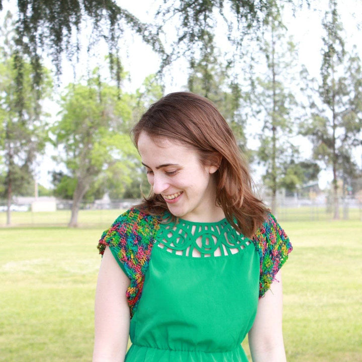 woman wearing the multicolored Emerald Pools Bolero Jacket outdoors