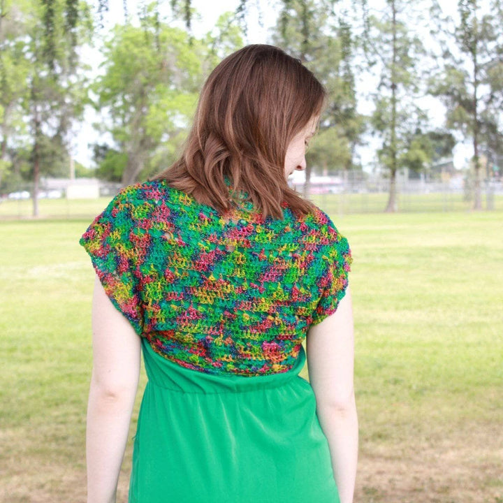 woman wearing the multicolored Emerald Pools Bolero Jacket outdoors