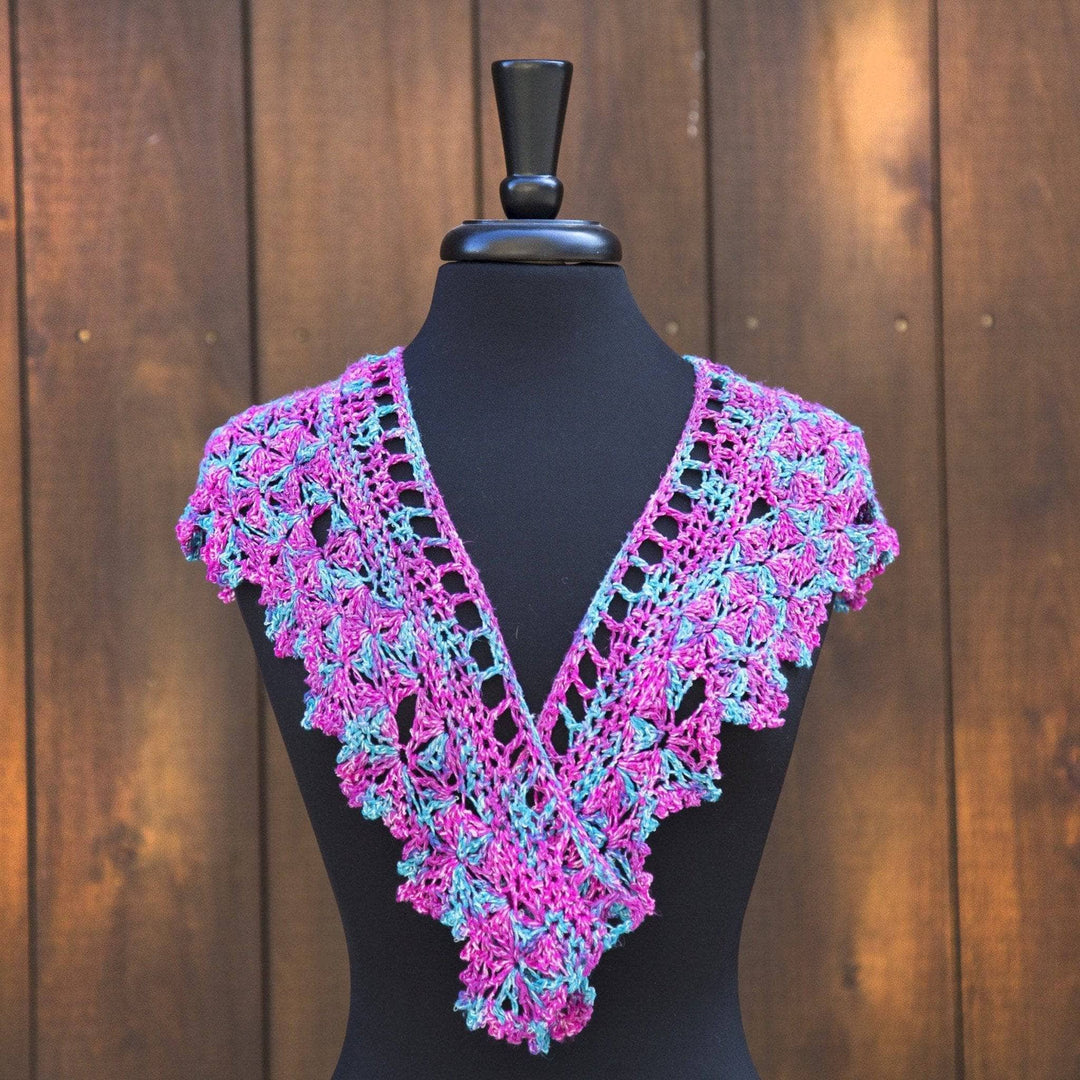 multicolored Fan Shell Shawlette over a black mannequin