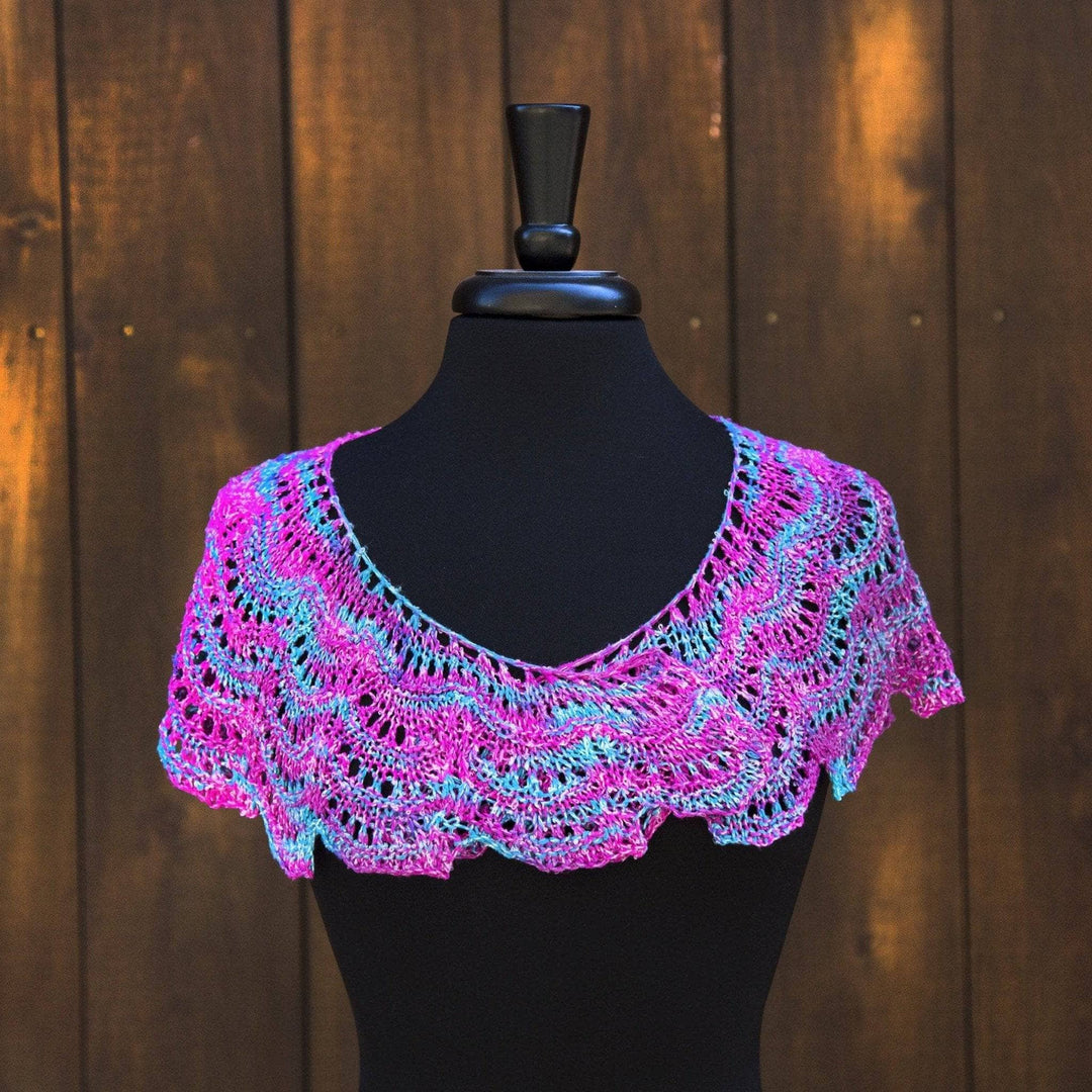 multicolored Fan Shell Shawlette over a black mannequin