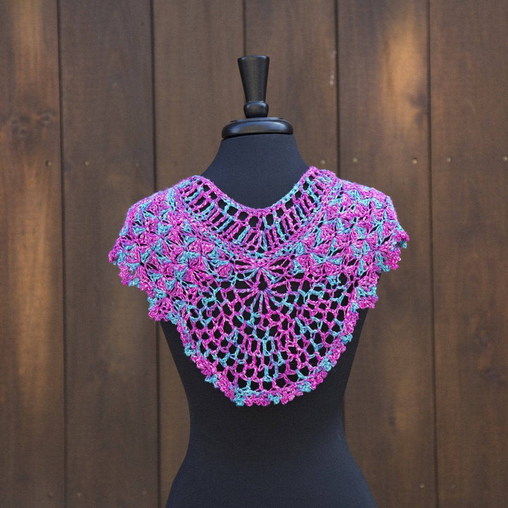 multicolored Fan Shell Shawlette over a black mannequin