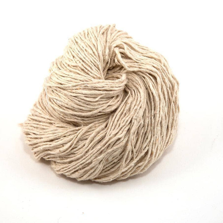 white yarn cake over a white background