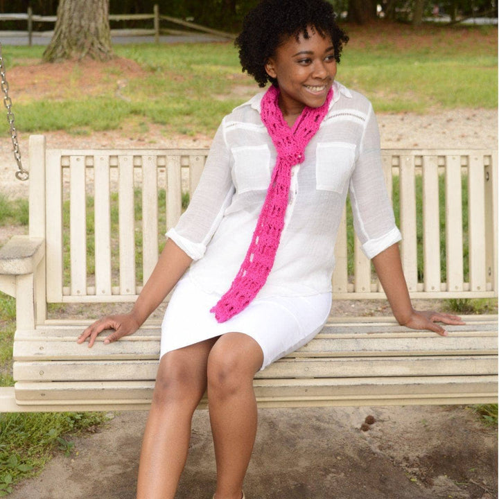 woman wearing a pink Skinny Scarf 