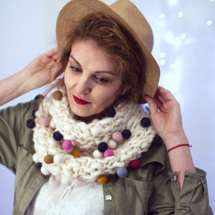 woman wearing a white Felt Ball Cowl