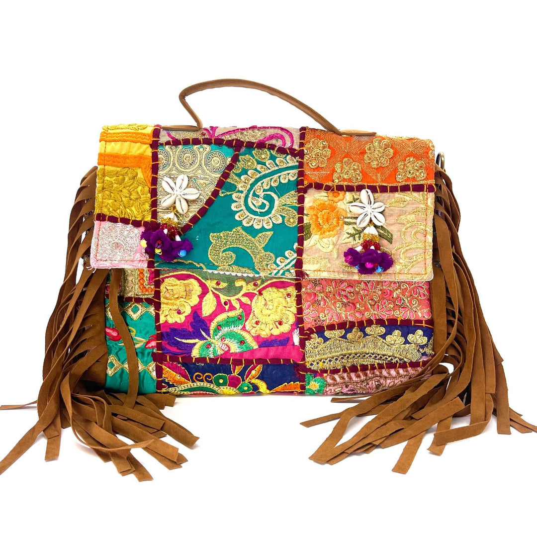 Colorful, handcrafted patchwork bag with fringe and intricate embroidery.