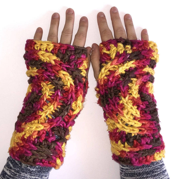 Women wearing red, yellow, and brown gloves on a white background