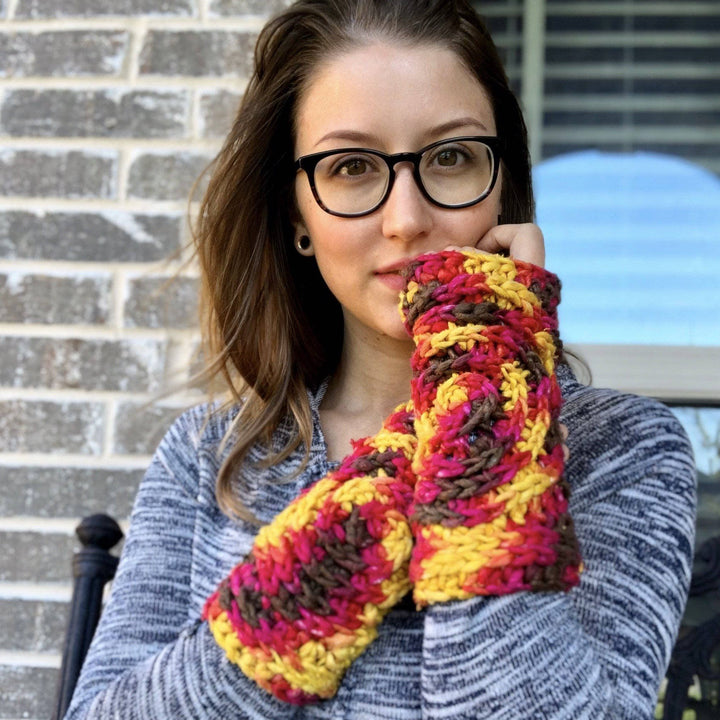 Women wearing red, yellow, and brown gloves