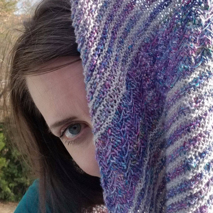 woman showing off a Frosted Forest Wrap outdoors