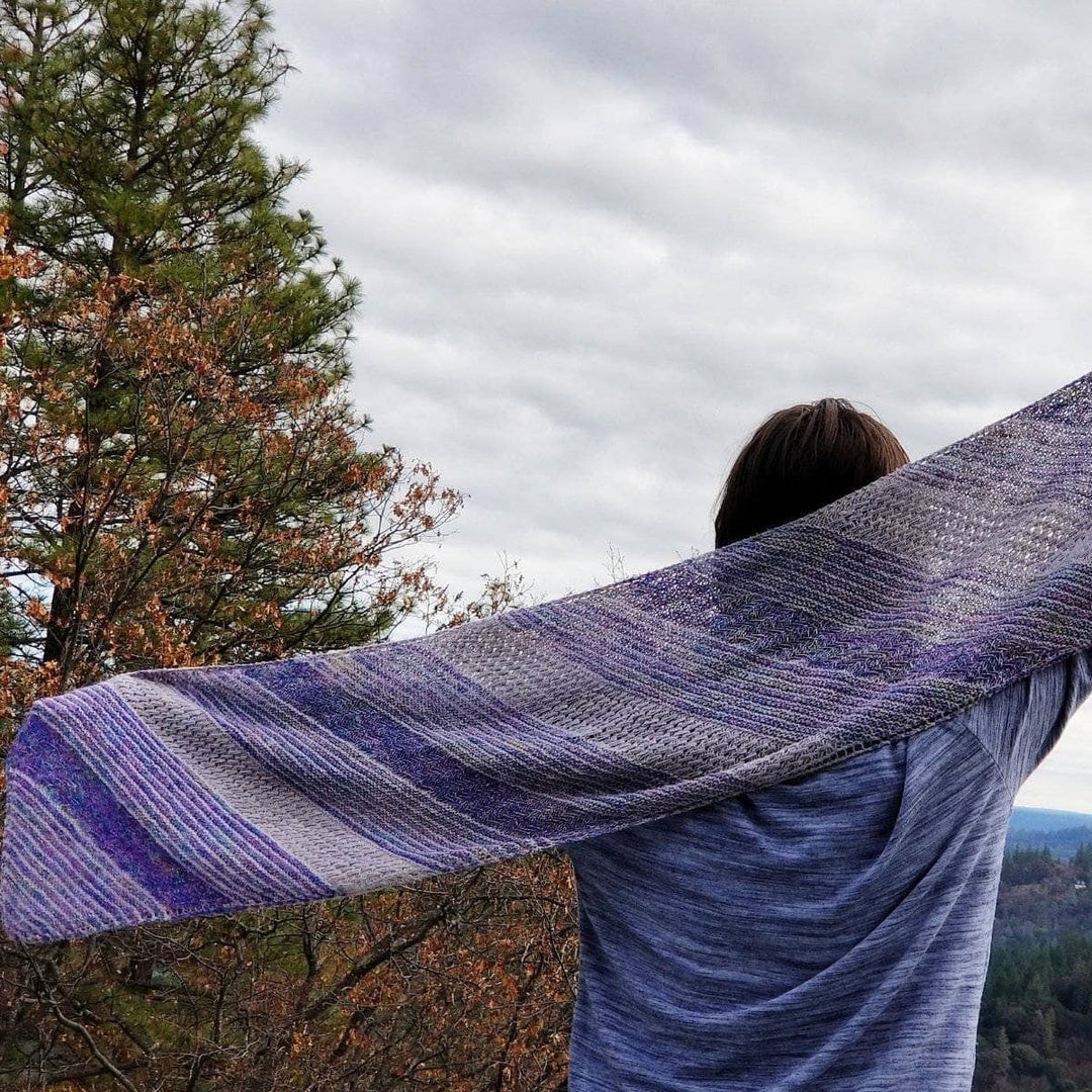 woman showing off a Frosted Forest Wrap outdoors