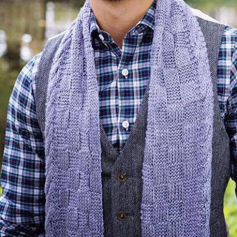 man wearing a purple scarf outdoors