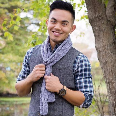 man wearing a purple scarf outdoors