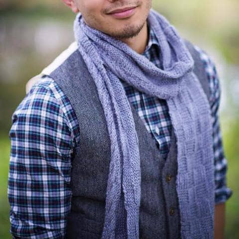 man wearing a purple scarf outdoors