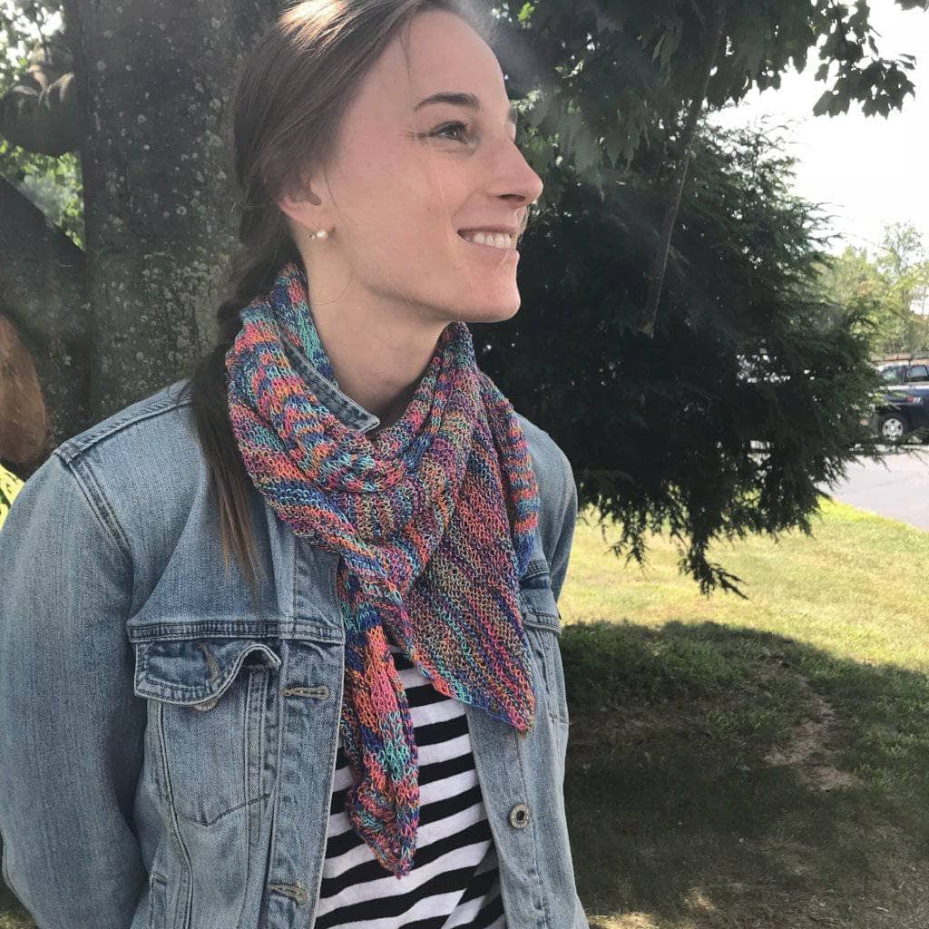 woman smiling and wearing a Hand Beaded Silk Shawl outdoors