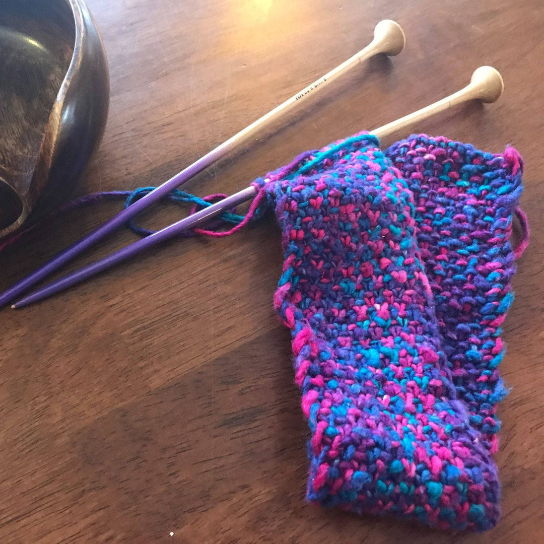 in progress photo of delicious headband in front of a wood background. 