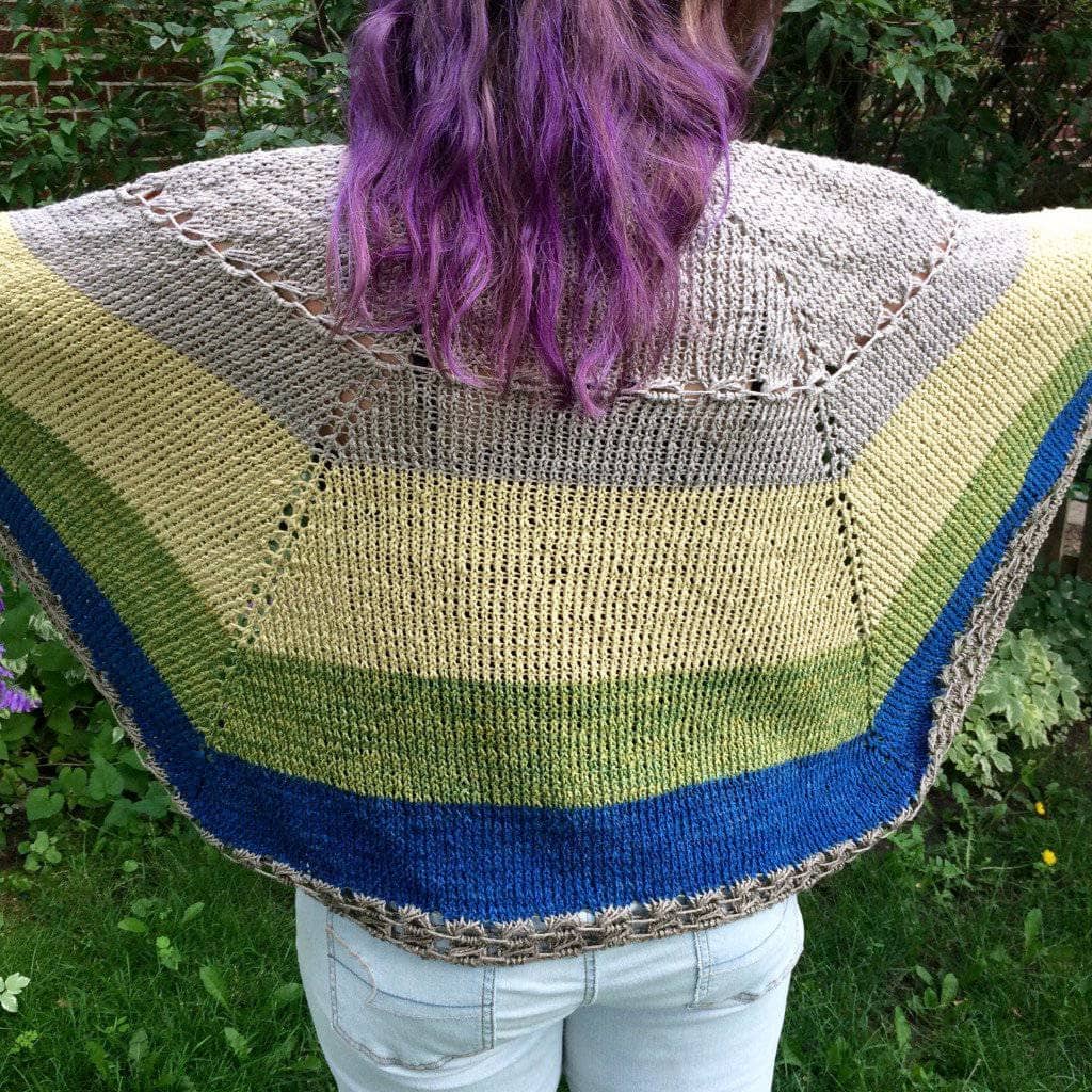 woman wearing the Herbal Sunrise Shawl outdoors