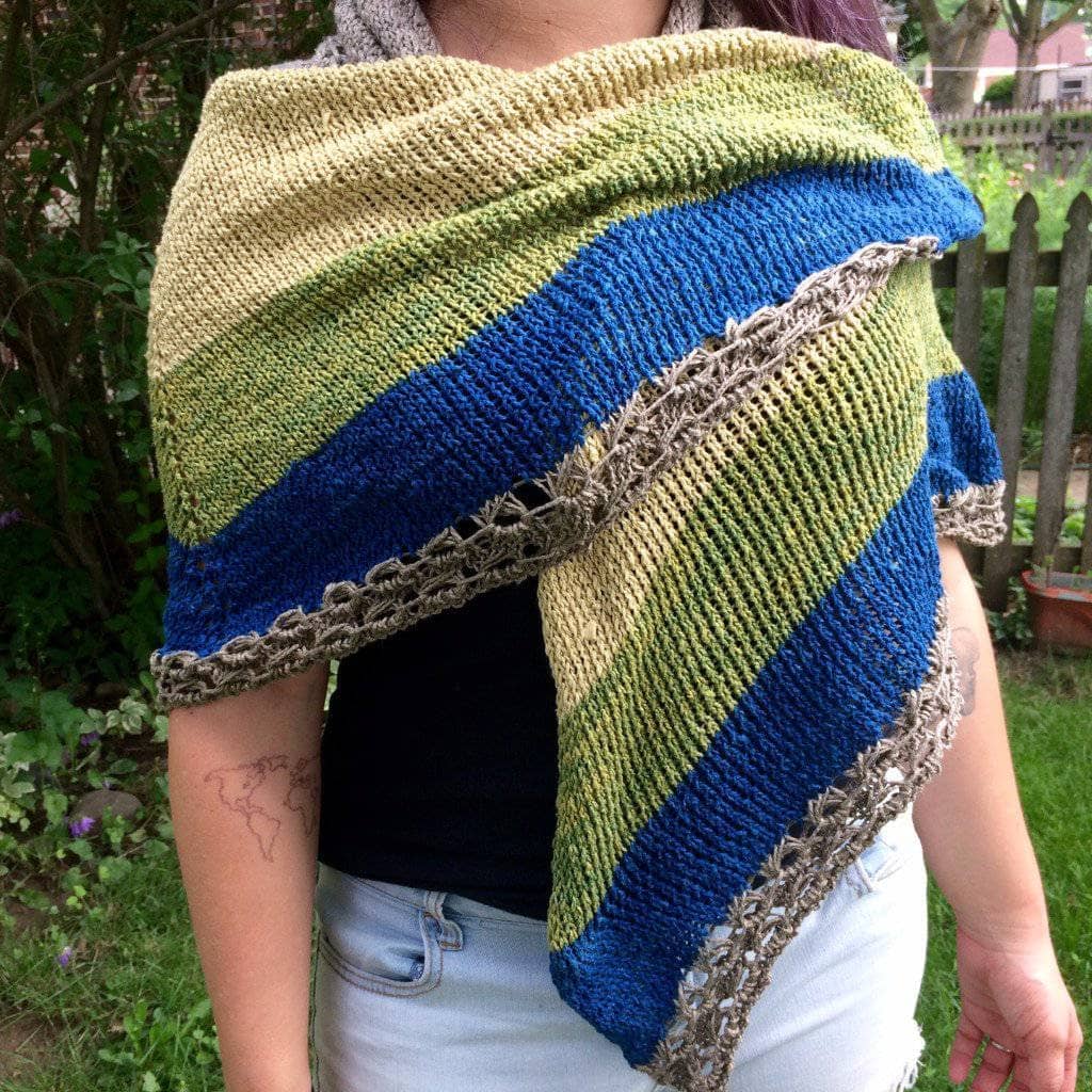 woman wearing the Herbal Sunrise Shawl outdoors