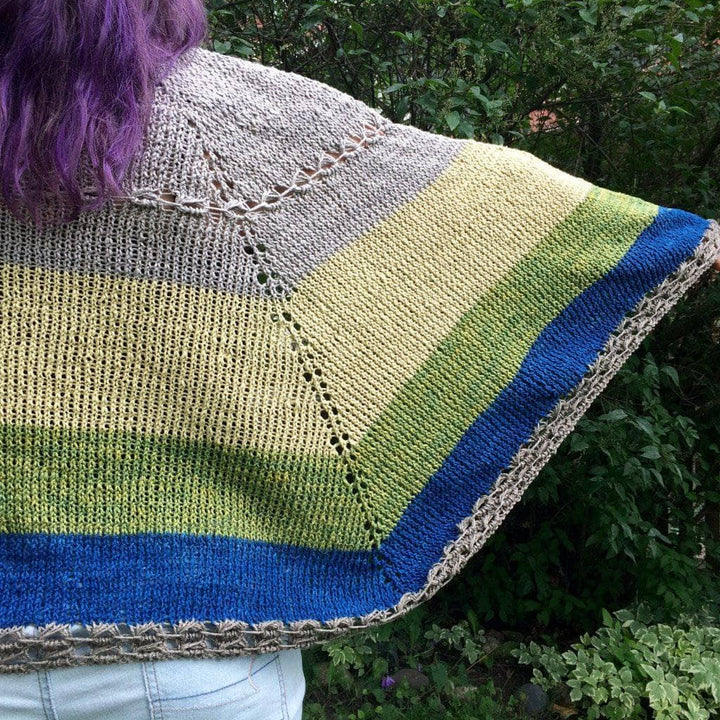 woman wearing the Herbal Sunrise Shawl outdoors