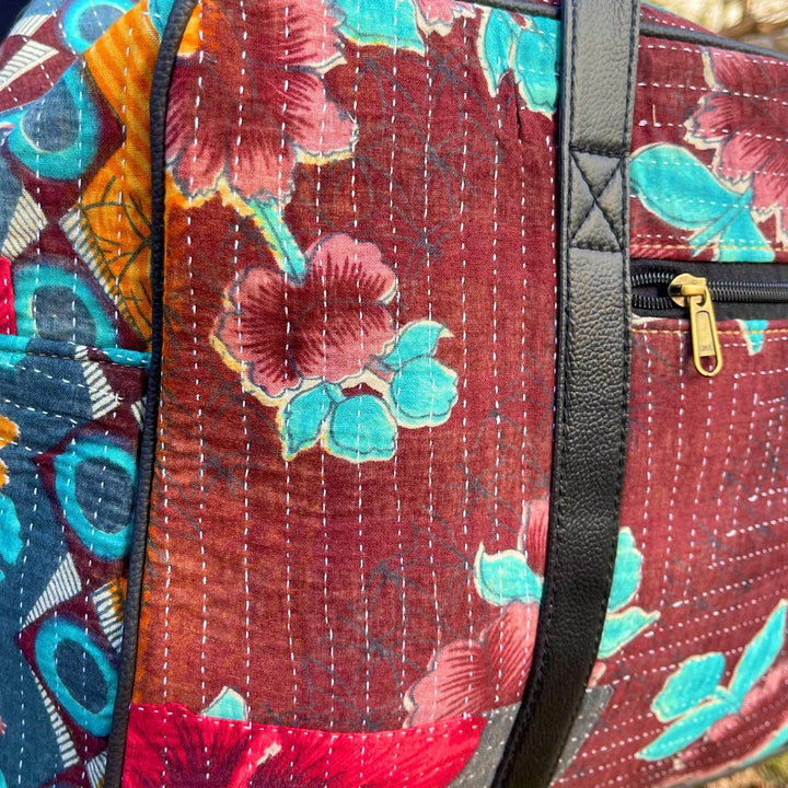 An up close shot of a Kantha Duffle Bag, showing the stitch work