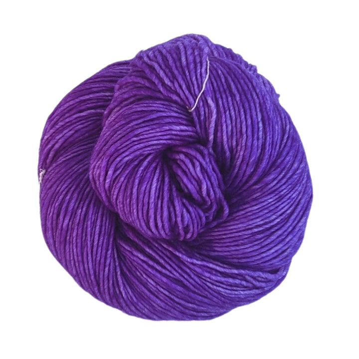 tonal purple yarn in front of a white background.