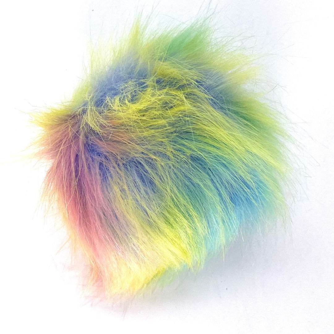 A plus 4.5 inch snap on pom pom in the colorway 'mermaid'