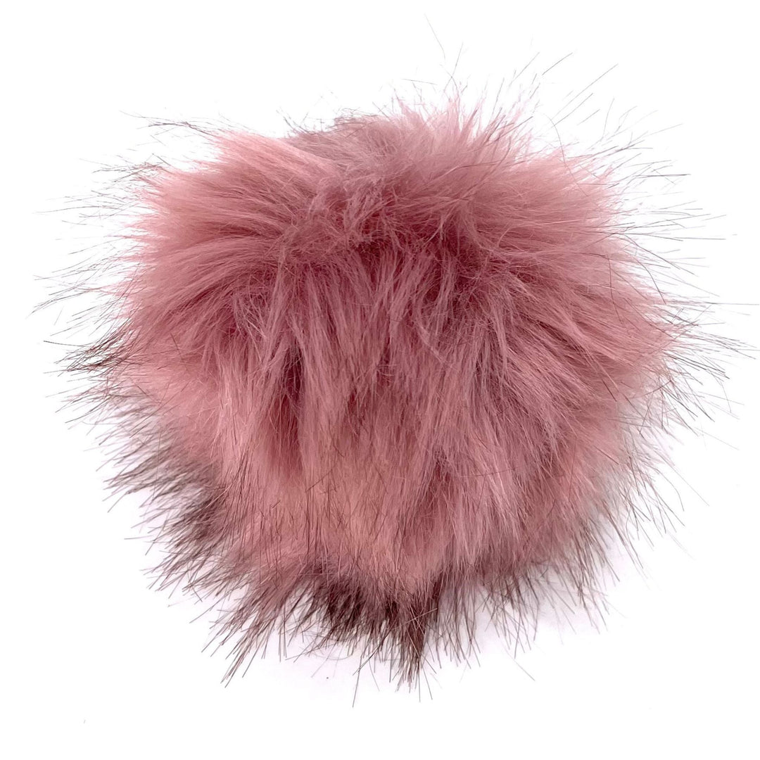 A plus 4.5 inch snap on pom pom in the colorway 'rose'