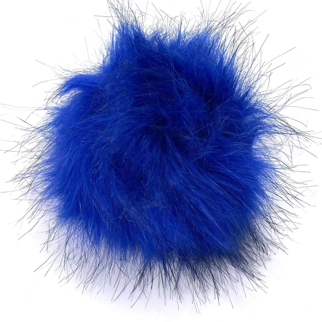 A plus 4.5 inch snap on pom pom in the colorway 'royal blue'