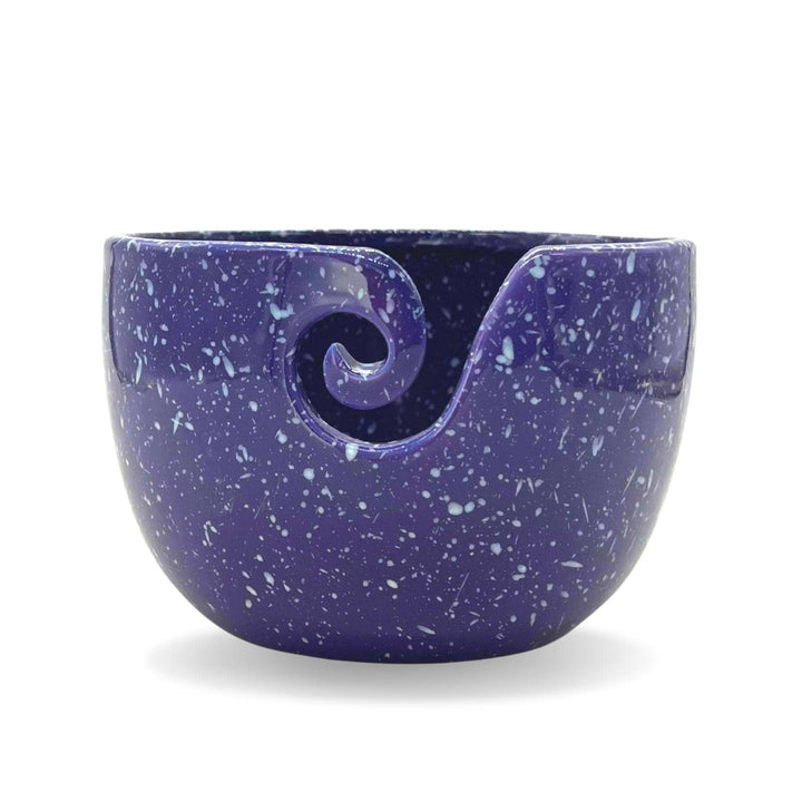 Purple Cosmic Ceramic Yarn Bowl with white speckles, displayed against a white background. This celestial-themed yarn bowl helps keep yarn clean, organized, and untangled during knitting or crochet projects.