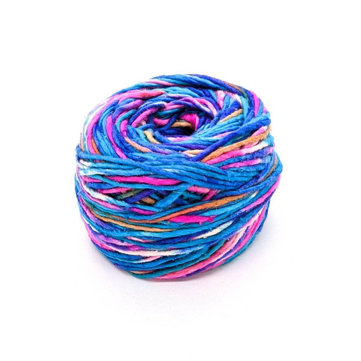 A cake of blue, pink, white, tan, and purple yarn on a white background