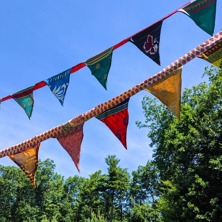 Handmade Recycled Sari Silk Bunting Banner hanging outside