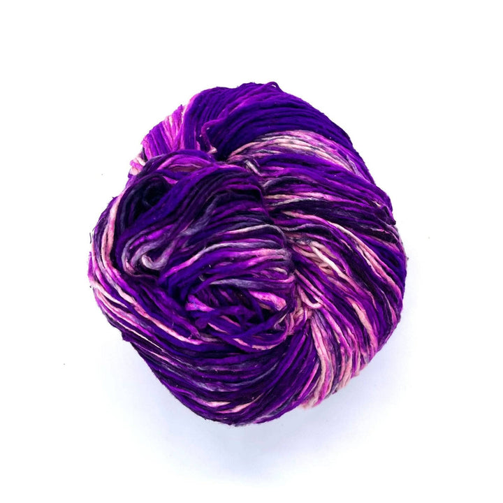 Violet, Purple, Lilac, and white Worsted weight yarn on a white background