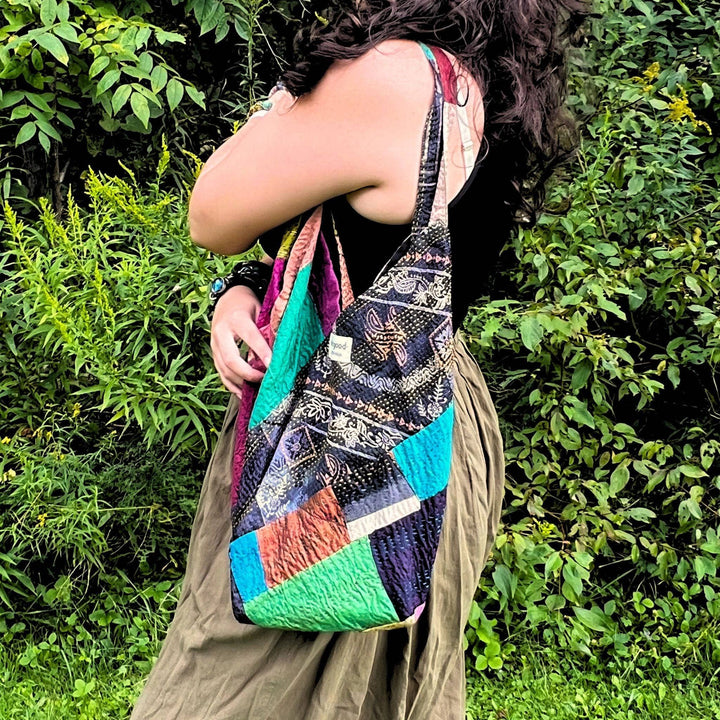 A woman wearing samosa Kantha Stitch Bag