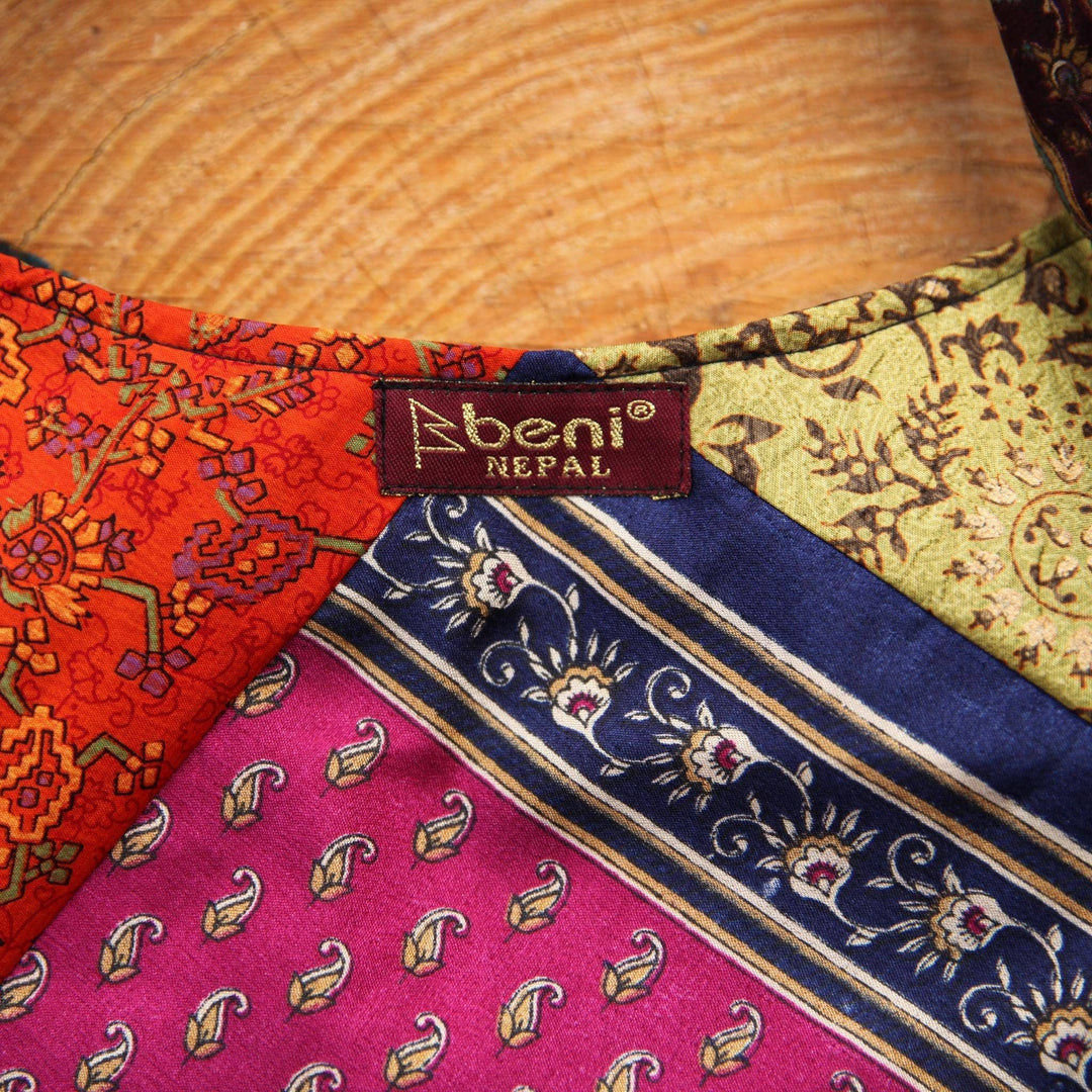 A close up of a clothe focused on the tag "beni NEPAL'