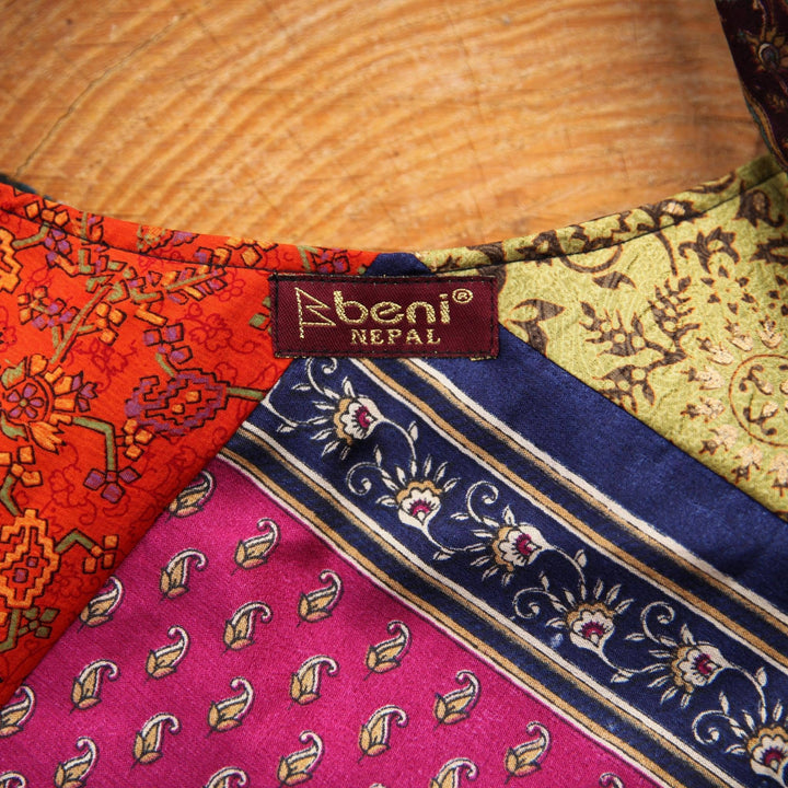 A close up of a clothe focused on the tag "beni NEPAL'