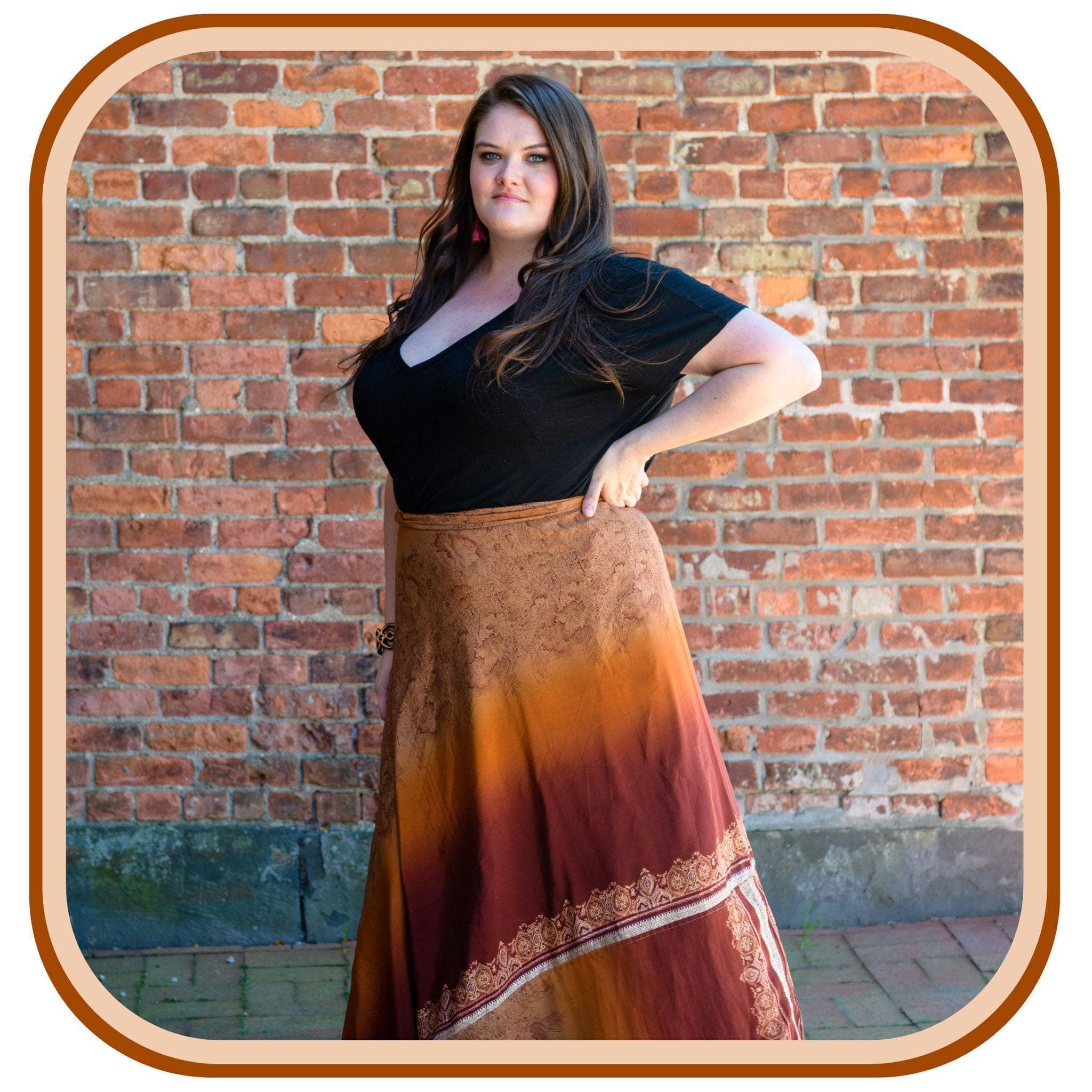 A woman wearing sari wrap skirt pumpkin spice.