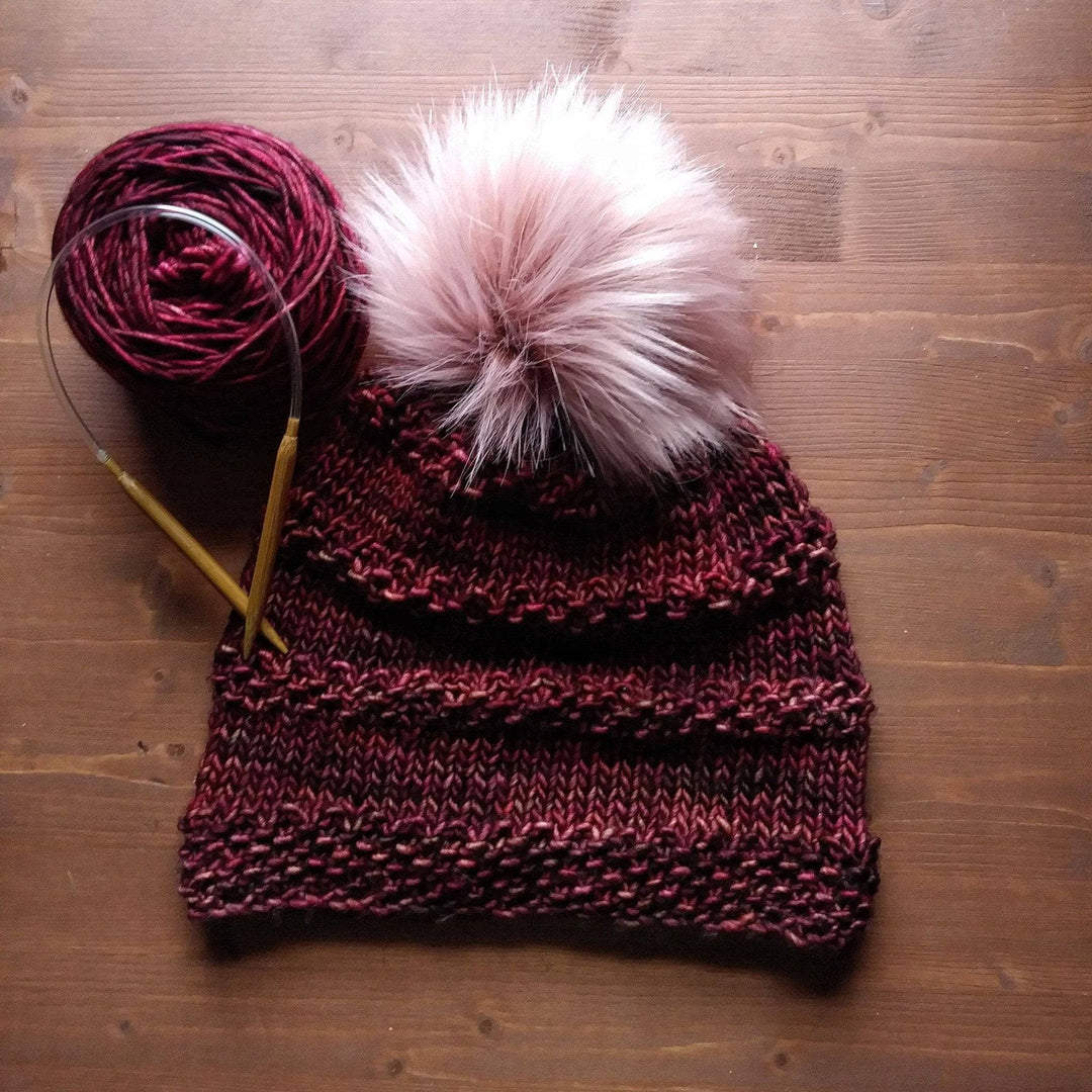 red beanie on a wood background