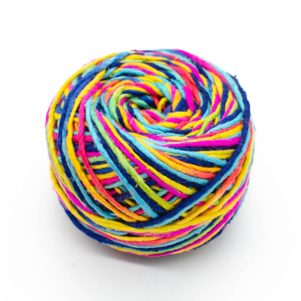 A ball of yarn with blue, yellow, green, pink, and purple hues in a spiral pattern.